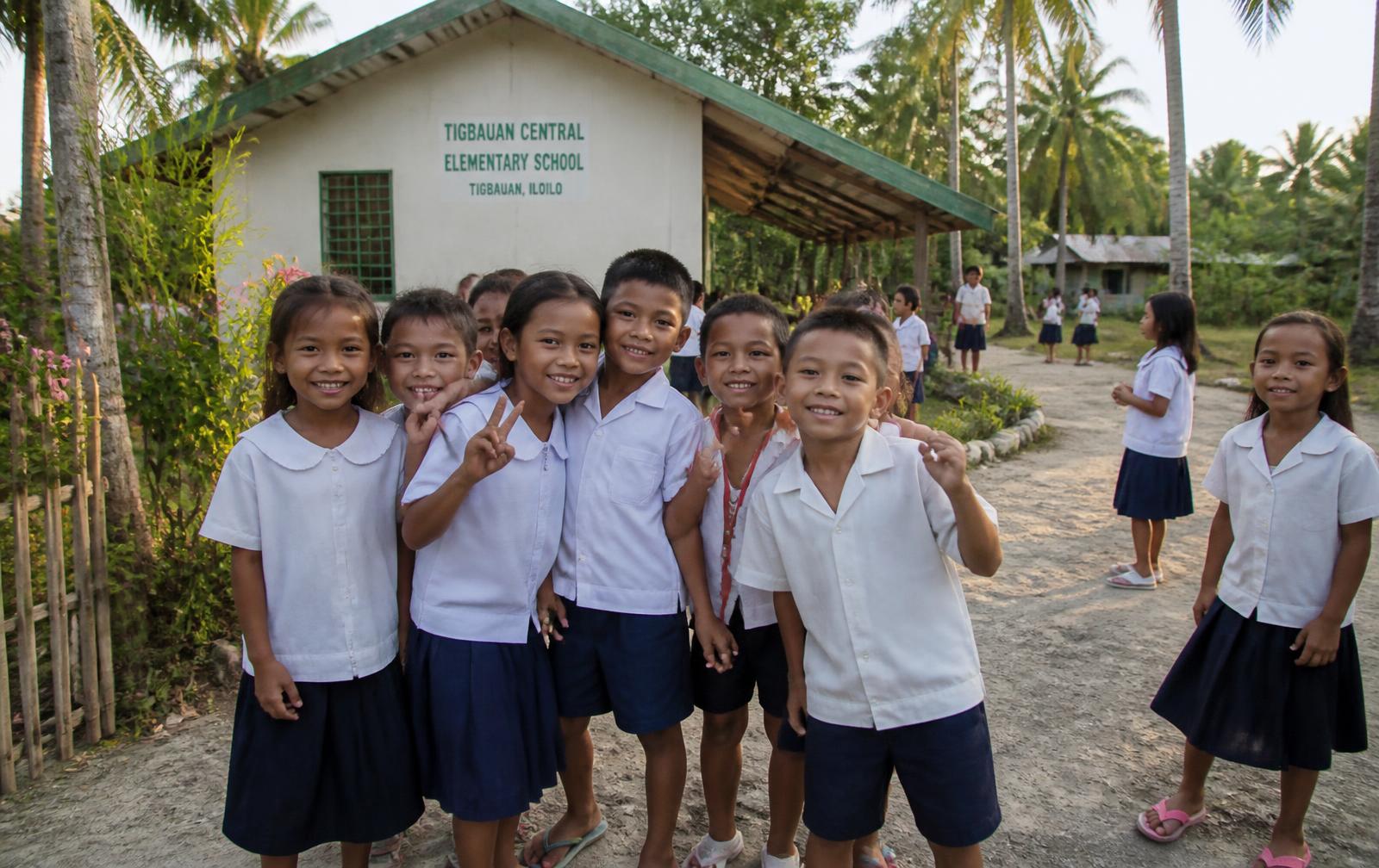 Students outside Naborot Carles Elementary School in Iloilo, Philippines